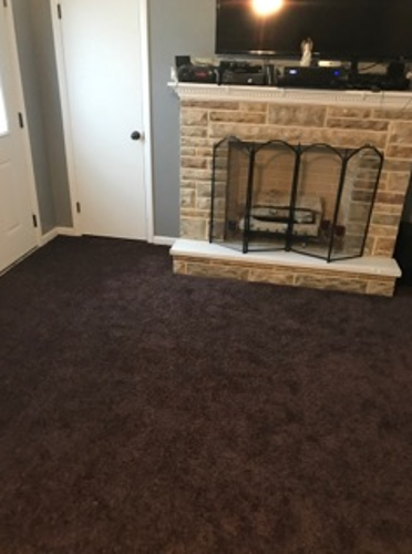 room with fireplace after flood damage restoration